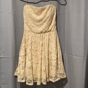 Cream colored lace fit and flare strapless dress
